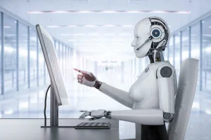 A robot using a desktop computer meaning Enterprise AI